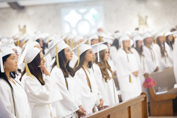 After processing into the Church, seniors were seated in pews, waiting for Mass to begin.
